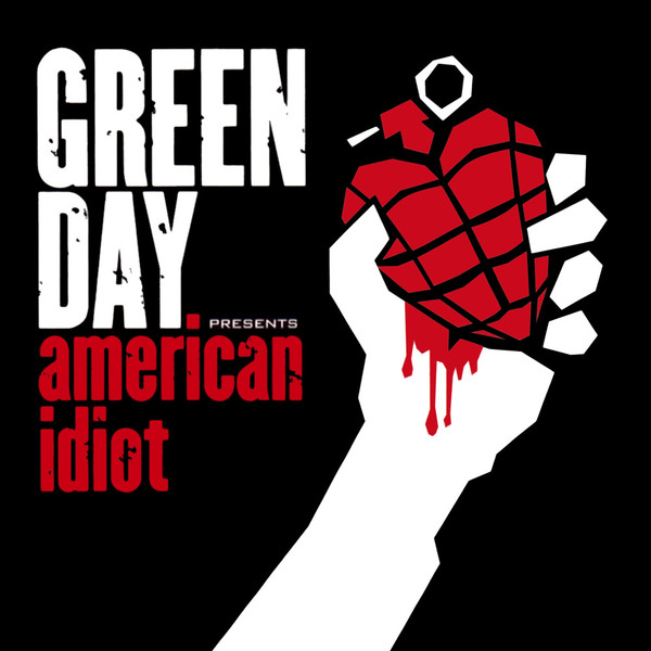 A picture of a hand holding a heart-shaped hand grenade..