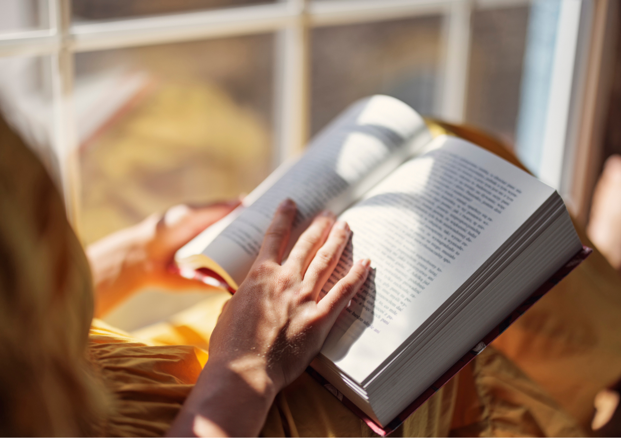 A picture of a person reading an interesting book.