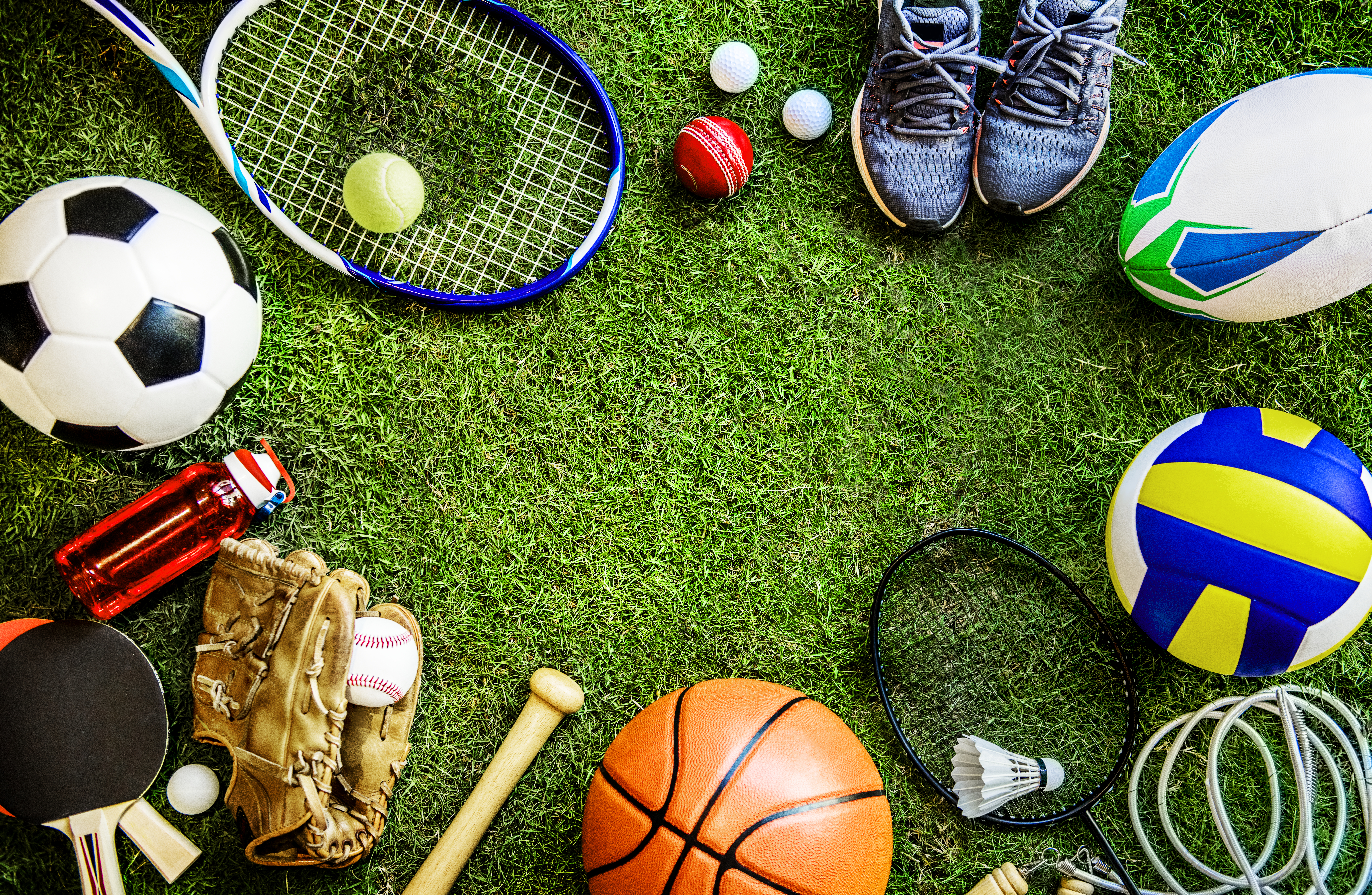 A picture of a variety of sports such as a tennis racket, football, and basketball.