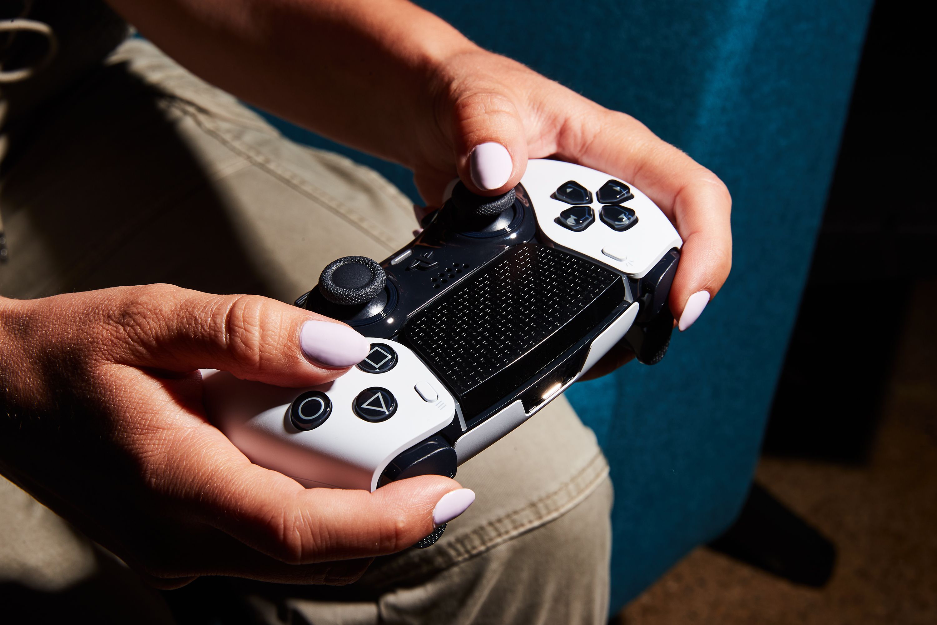 A picture of a person holding a video game controller.